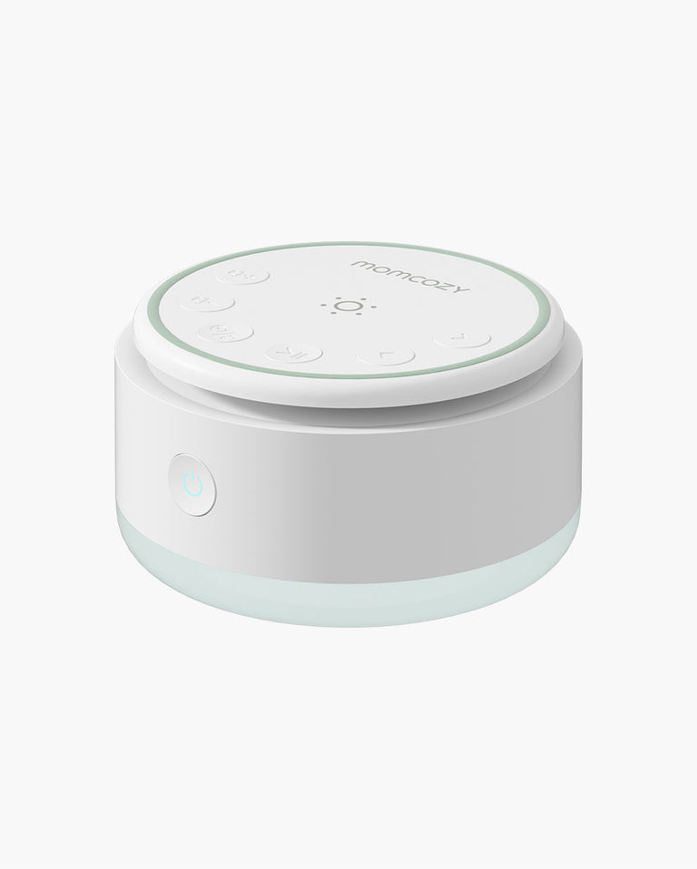 Momcozy Portable Baby Sound Machine - White and blue design, for baby sleep. Includes control buttons and brand logo.