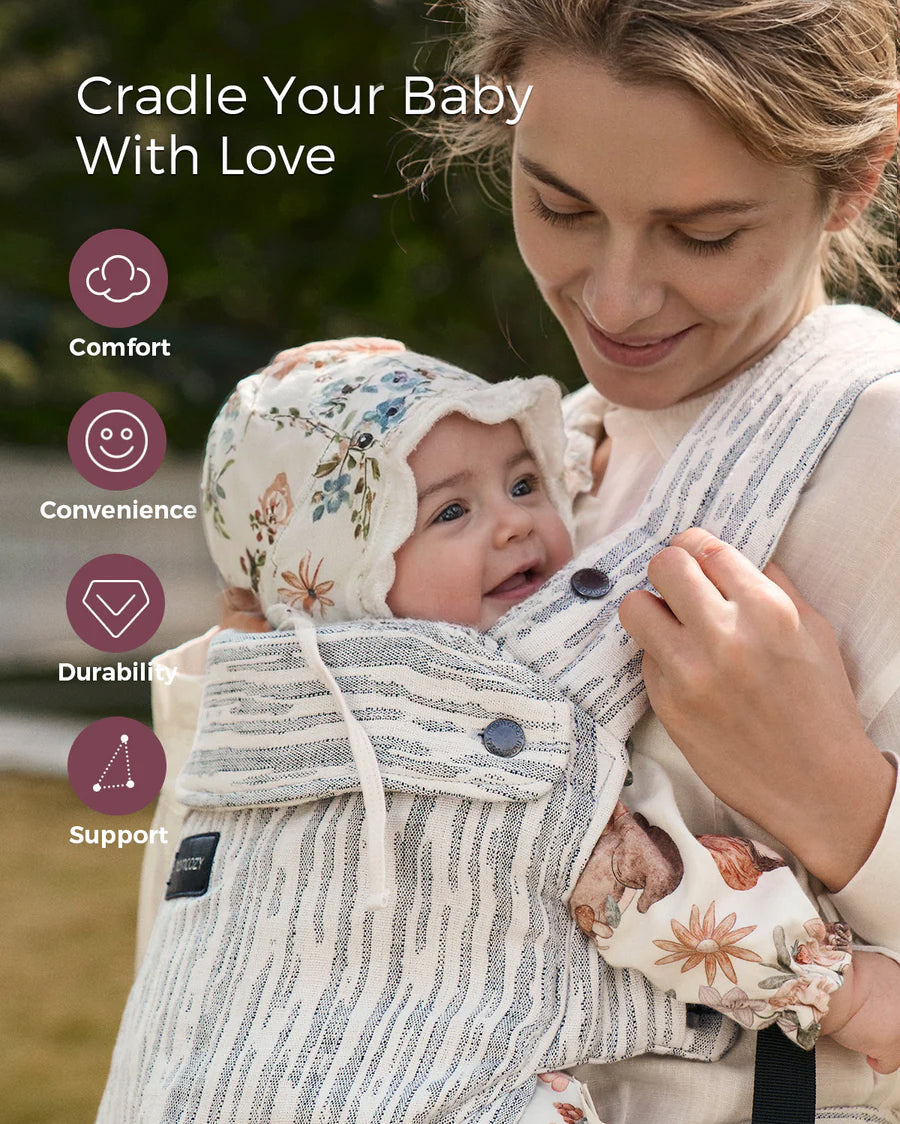 Momcozy PureHug baby carrier, mother babywearing. Striped design offers comfort and support for babywearing.