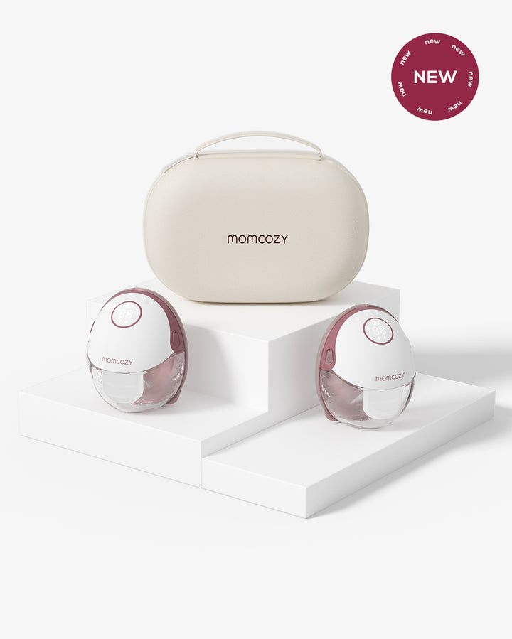 Momcozy M6 hands-free breast pump set in new carrying case, white and pink design.