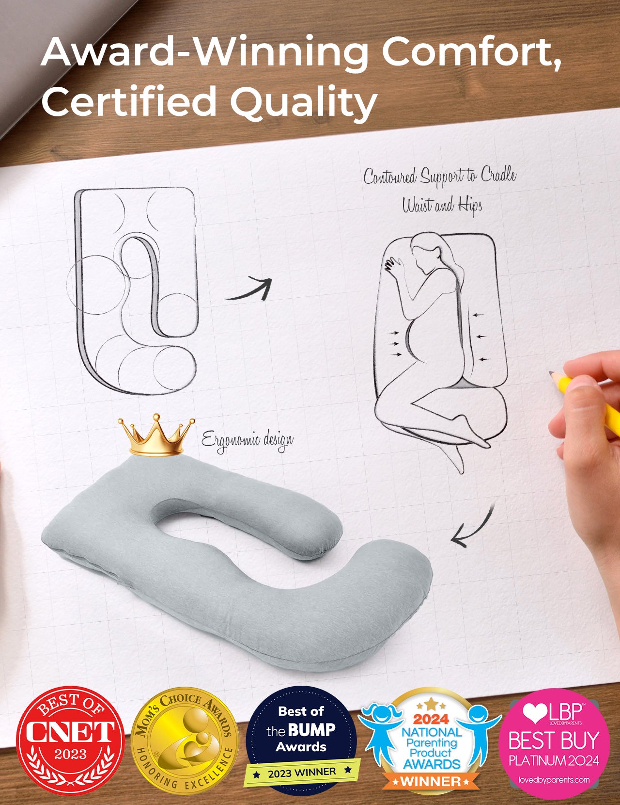 Light grey U-shaped maternity pillow, ergonomic design, supports pregnant women. Award-winning comfort.