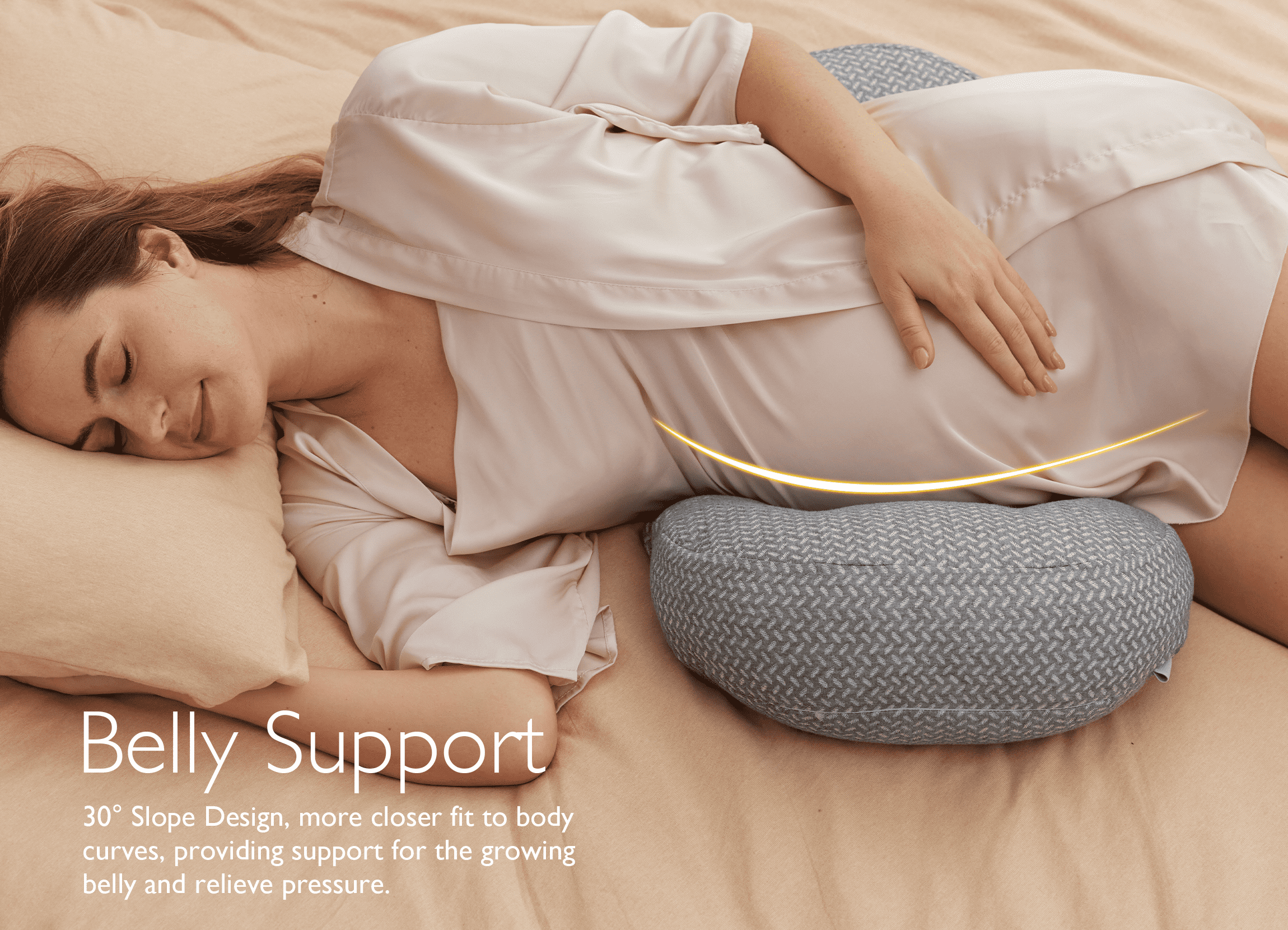 Pregnant woman resting on a Pregnancy Wedge Pillow with Cooling Cover for belly support.