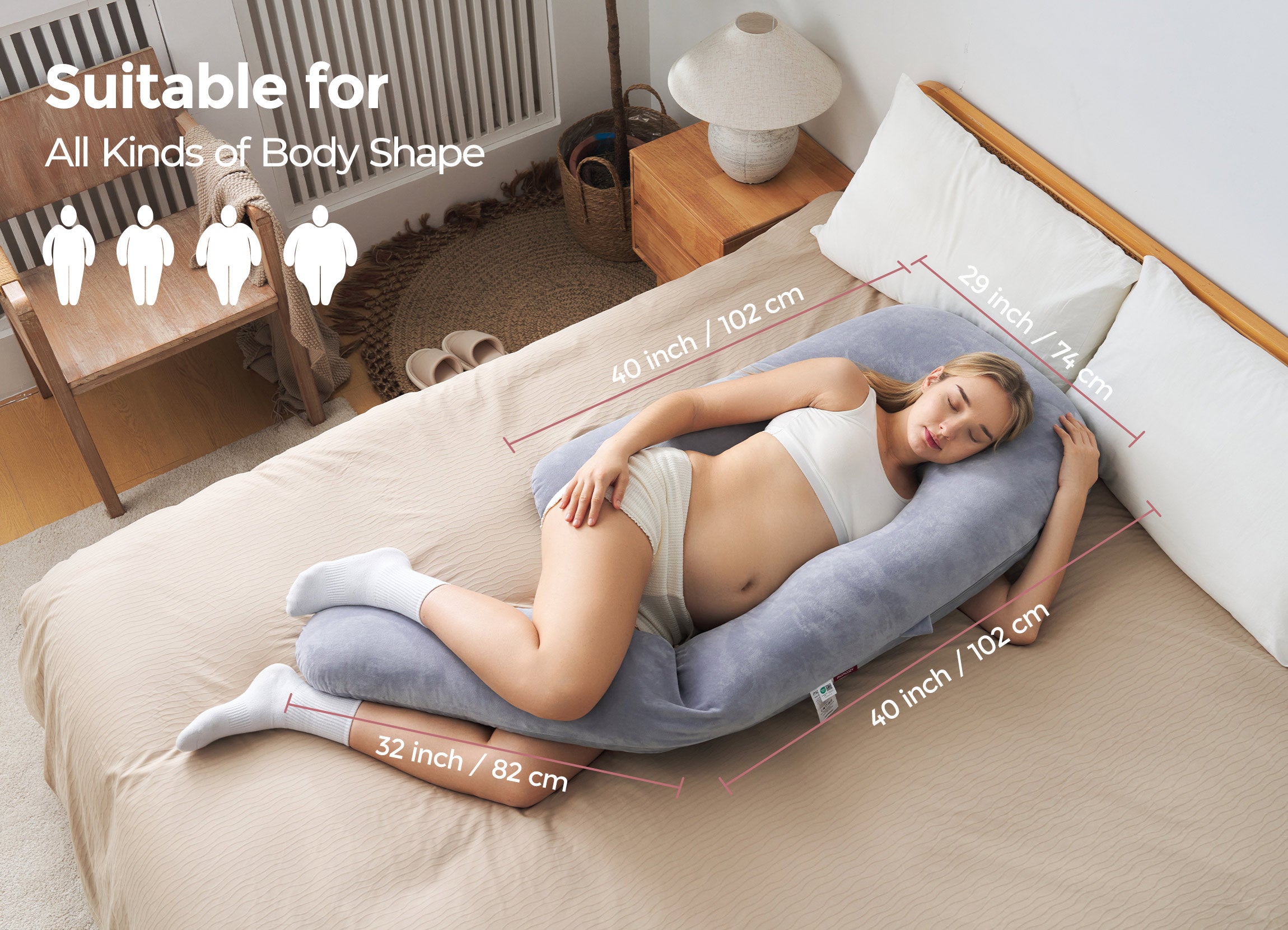 Momcozy pregnancy pillow for comfort. Pregnant woman sleeping on gray pillow, promoting support. Dimensions displayed.
