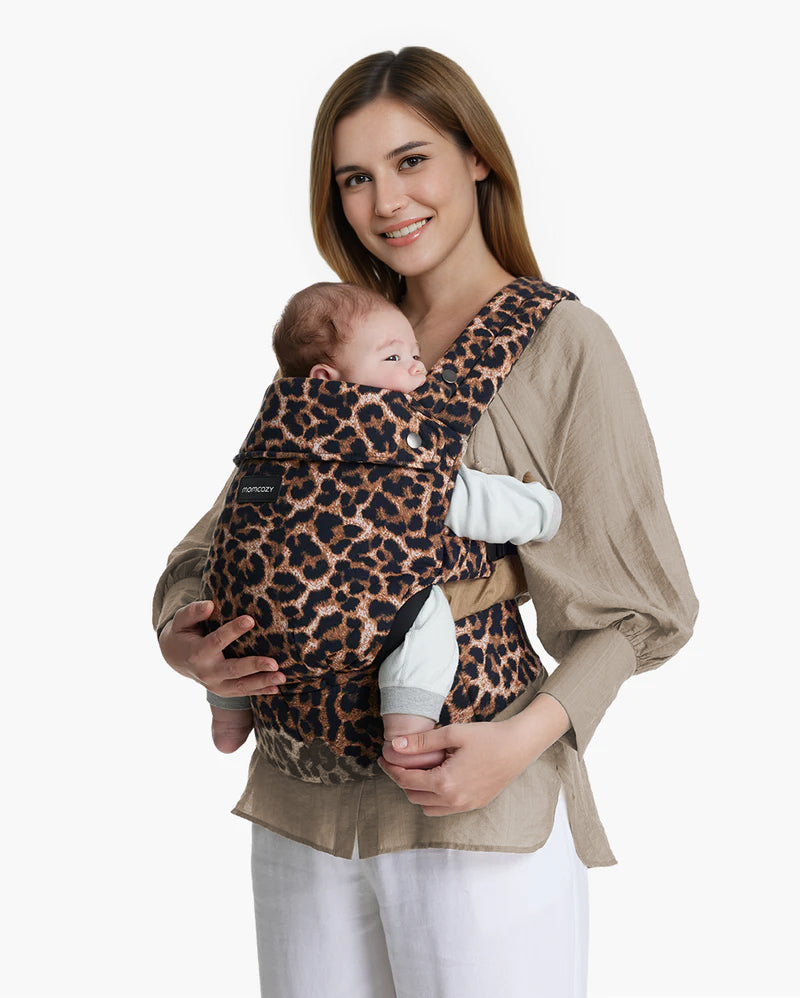 Leopard print Momcozy PureHug baby carrier, with mother and baby. Comfortable and stylish design for babywearing.